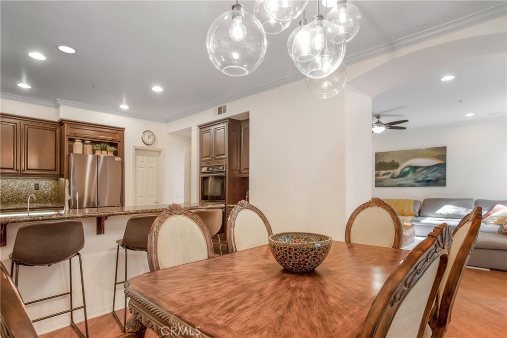 3 Avenida Cristal San Clemente, CA 92673 - Photo 9 of 36 a large kitchen with stainless steel appliances granite countertop a table and chairs