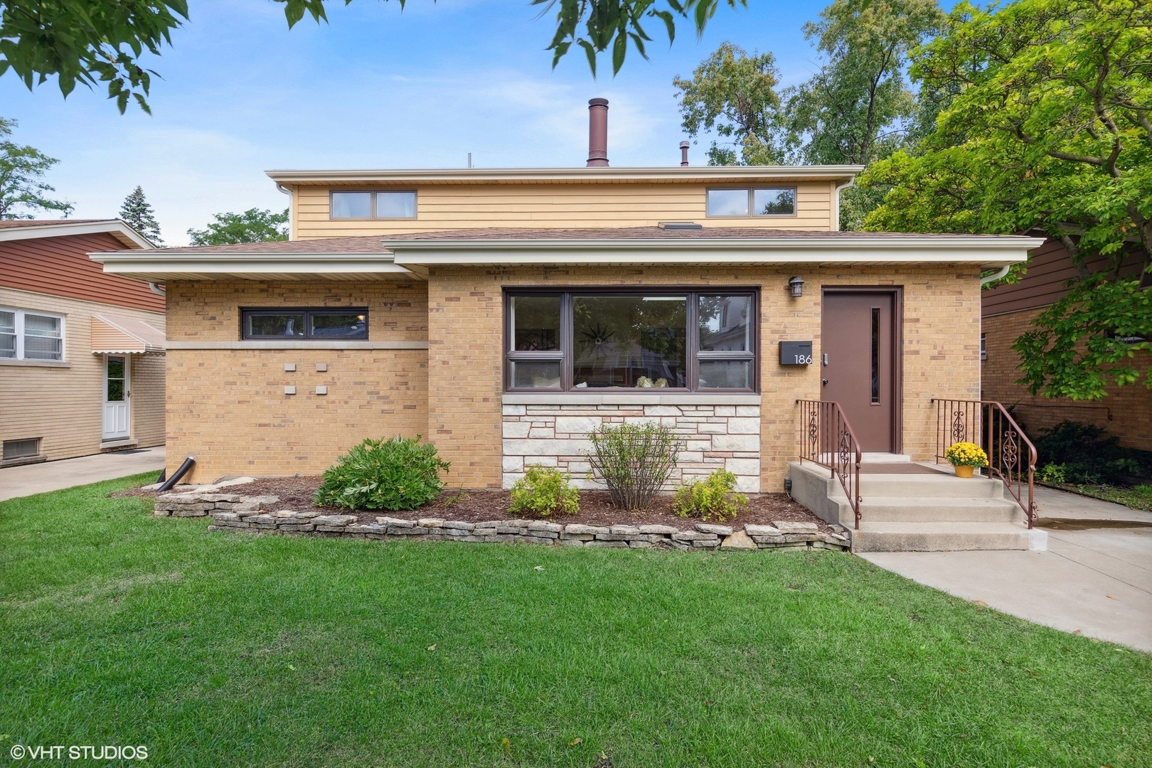 front view of a house with a yard