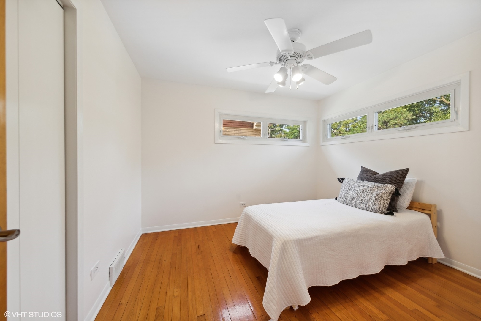 186 West Burlington Street Riverside, IL 60546 - Photo 8 of 19 a bedroom with a bed and wooden floor
