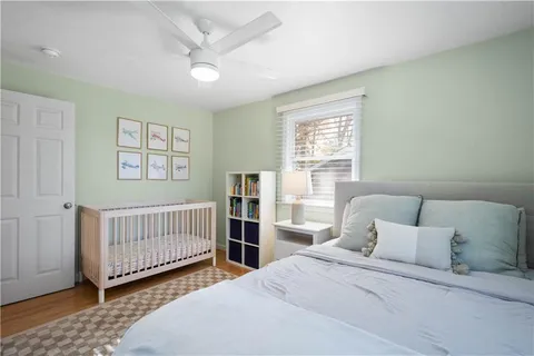 a bedroom with a bed and a dresser