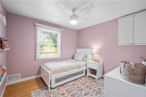 a bathroom with a tub and shower