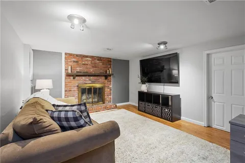 a large bedroom with a bed and furniture