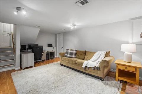 a bathroom with a sink mirror and toilet