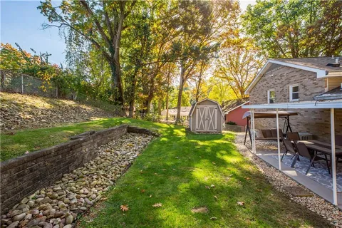 a view of a house with a yard porch and sitting area