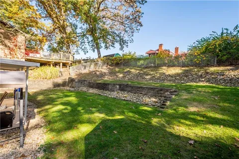 a view of a house with a yard porch and sitting area
