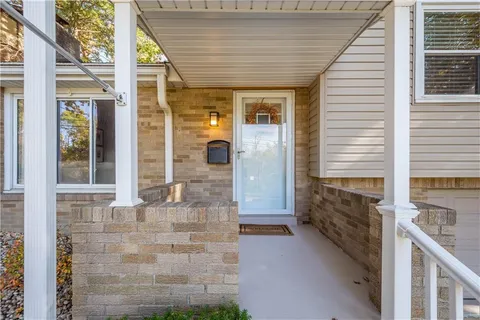 a view of an entryway with wooden floor