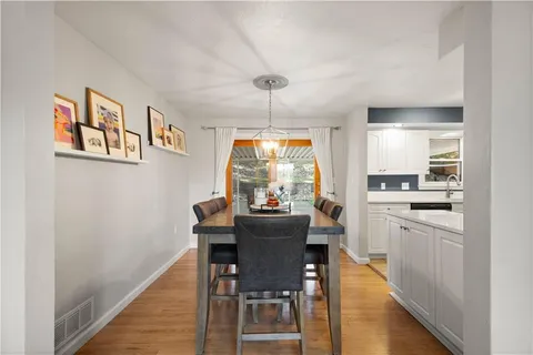 a kitchen with a sink appliances and cabinets
