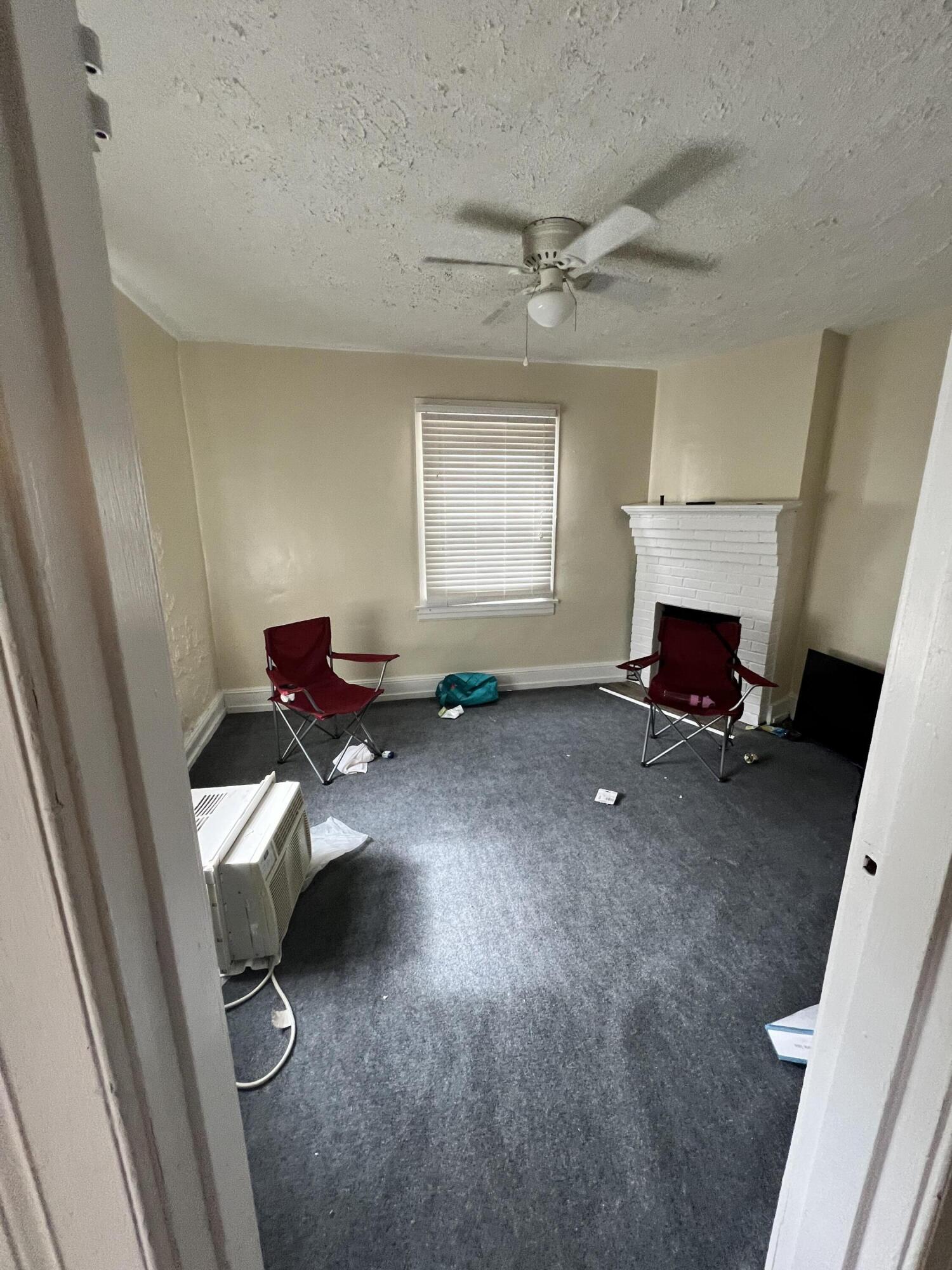 1011 Roundabout Road Martinsville, VA 24112 - Photo 6 of 17 a living room with furniture and a fireplace