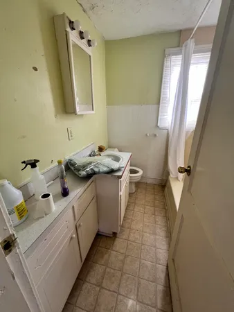 a utility room with cabinets washer and dryer