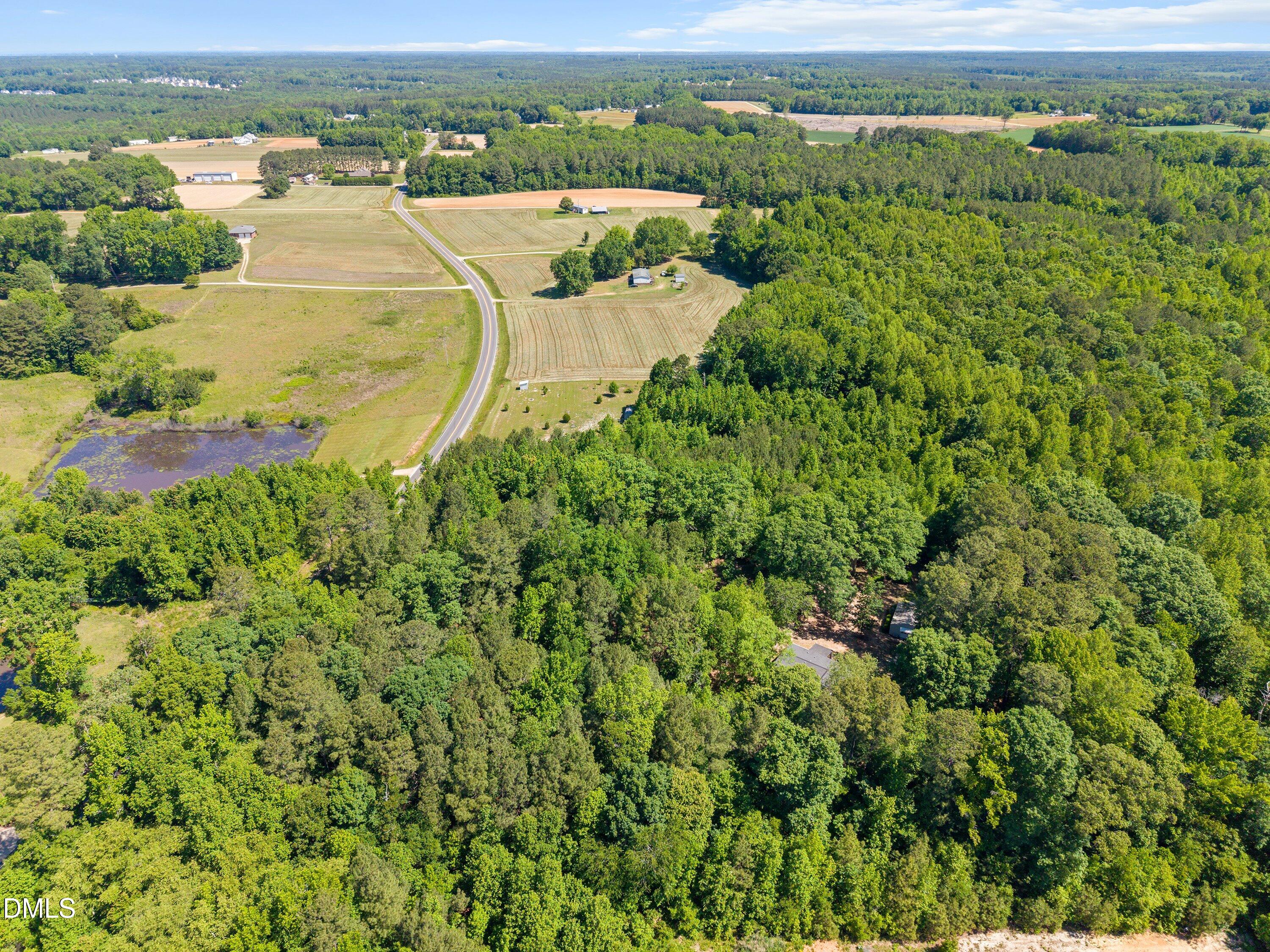 1000 Richardson Road Zebulon, NC 27597 - Photo 9 of 14 an aerial view of residential houses with outdoor space and trees