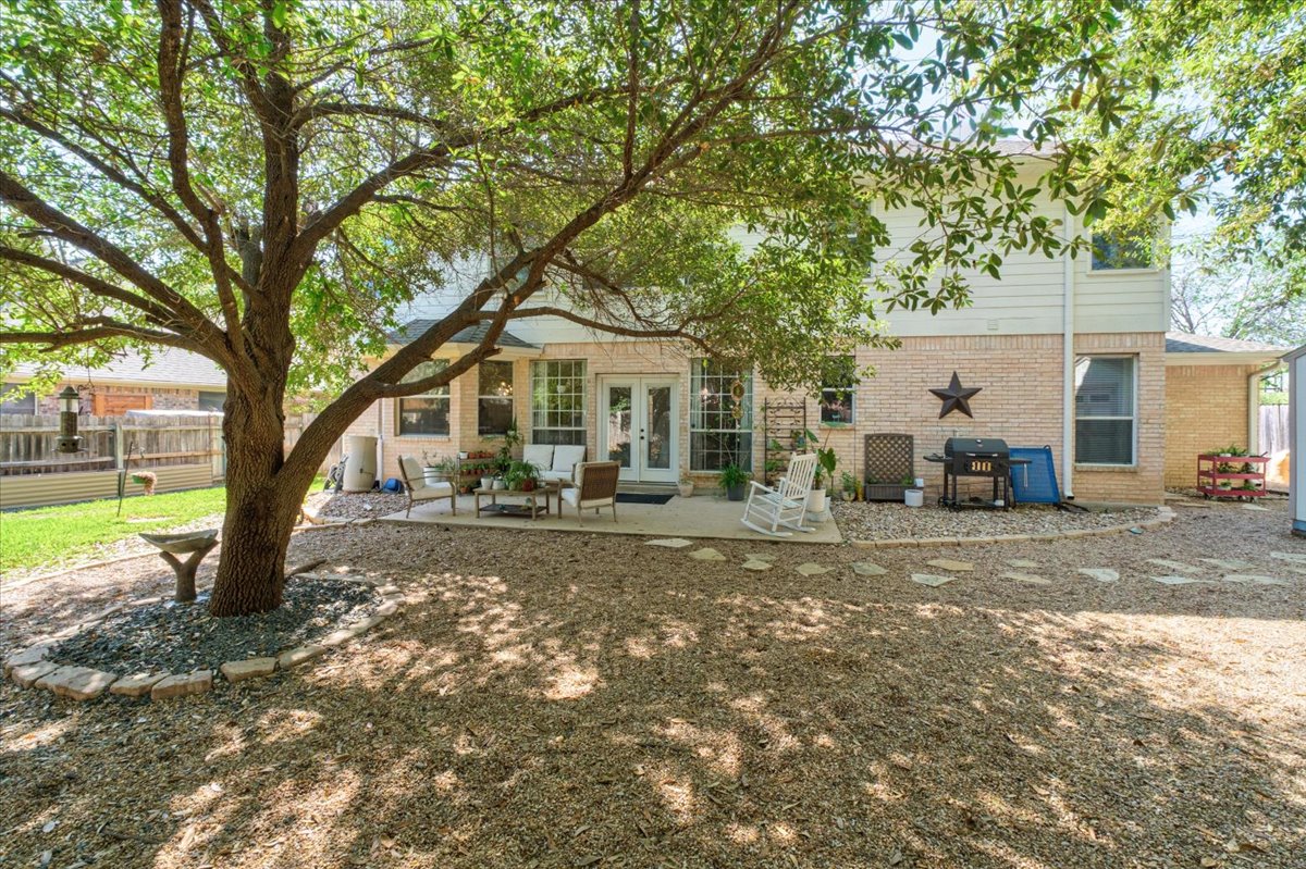 455 Logan Road Georgetown, TX 78628 - Photo 30 of 35 a front view of a house with a tree s