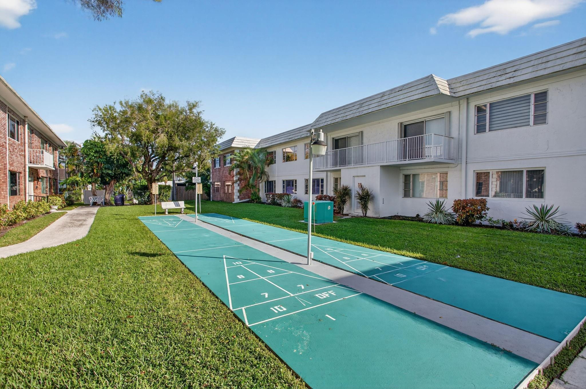 418 South Cypress Road, Unit 110 Pompano Beach, FL 33060 - Photo 20 of 28 a view of a house with a yard