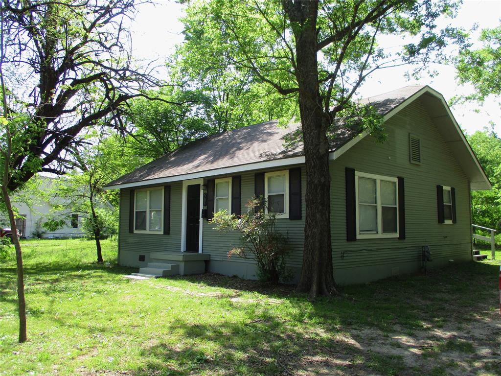 Single story home with a front yard, crawl space, and a shingled roof