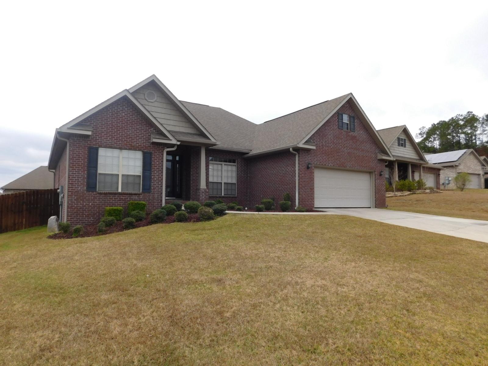 721 Lime Lane Crestview, FL 32536 - Photo 1 of 27 a front view of house with yard and garage