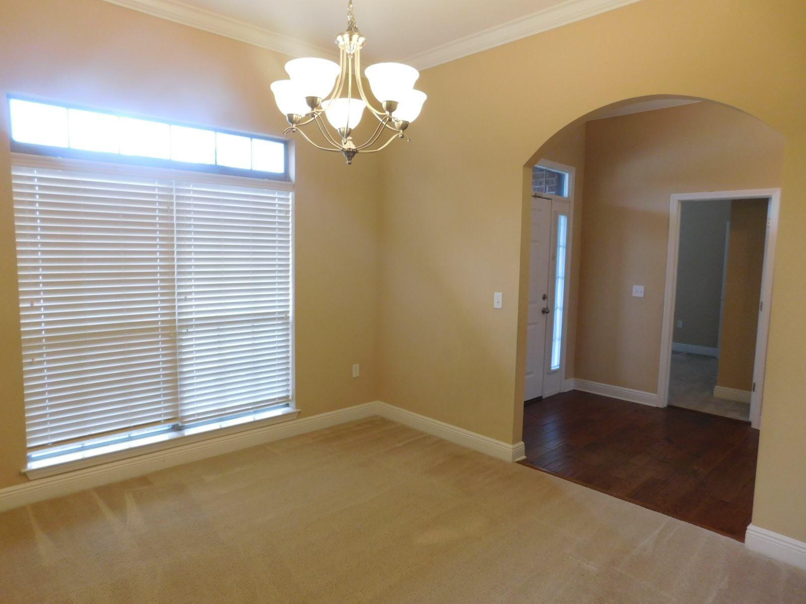 721 Lime Lane Crestview, FL 32536 - Photo 13 of 27 an empty room with wooden floor