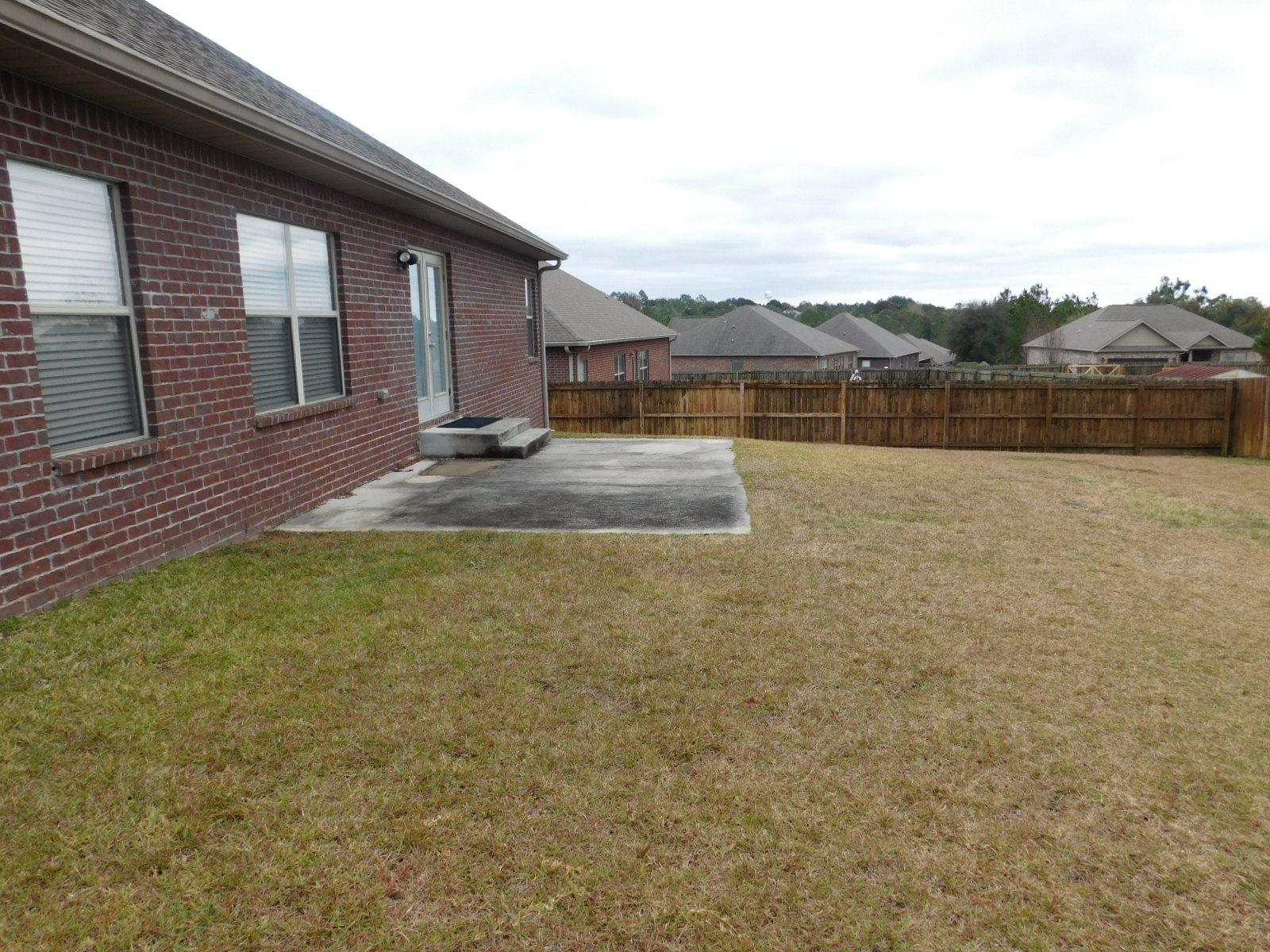 721 Lime Lane Crestview, FL 32536 - Photo 7 of 27 a view of a house with a yard