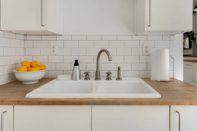 a view of a kitchen with a refrigerator