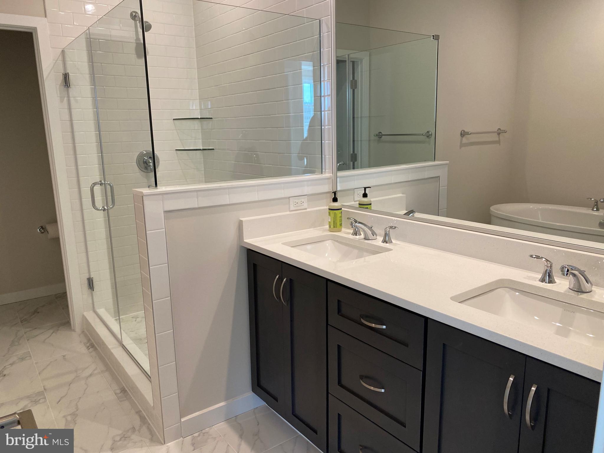 1708 Anderson Road McLean, VA 22102 - Photo 9 of 13 a bathroom with a sink and a mirror
