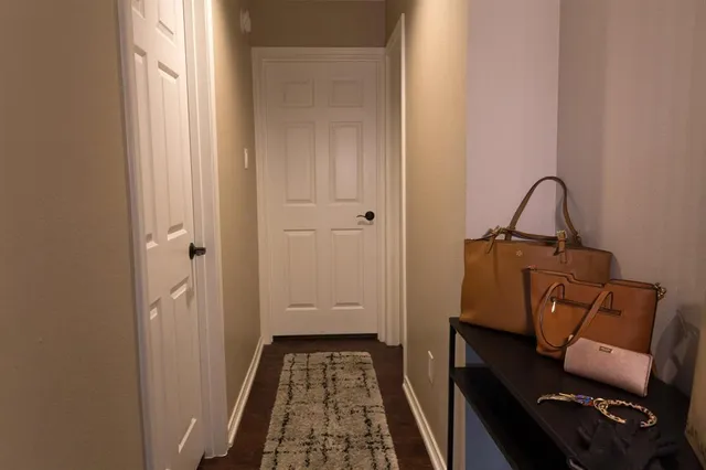 a view of bedroom with furniture and wooden floor