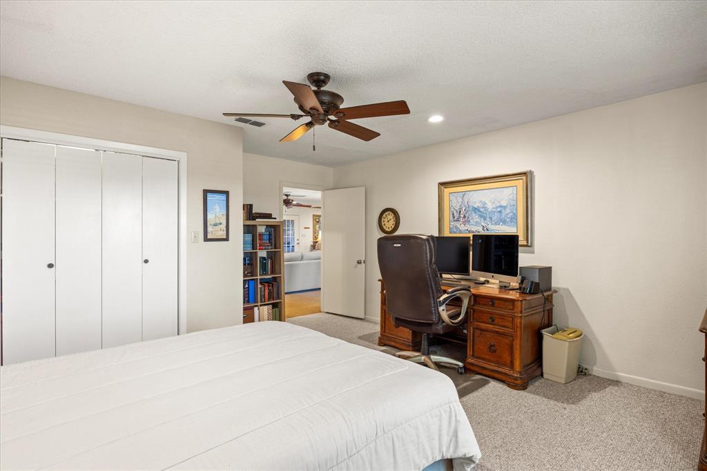 17305 Highway 281 Hico, TX 76457 - Photo 15 of 28 a bed room with a bed and a tv