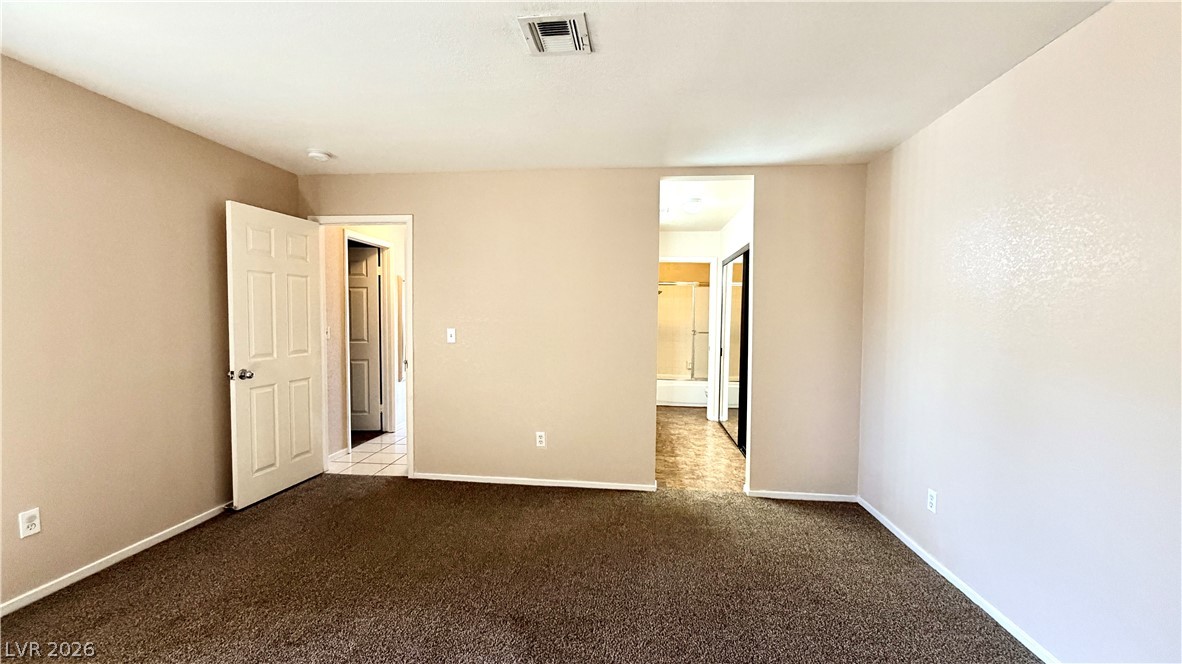6250 West Flamingo Road, Unit 4 Las Vegas, NV 89103 - Photo 17 of 45 This versatile room offers an adaptable space for a bedroom or home office.