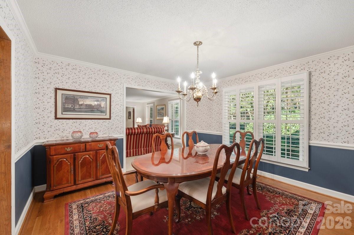 207 Lost Corner Road Morganton, NC 28655 - Photo 14 of 46 a view of a dining room with furniture window and wooden floor