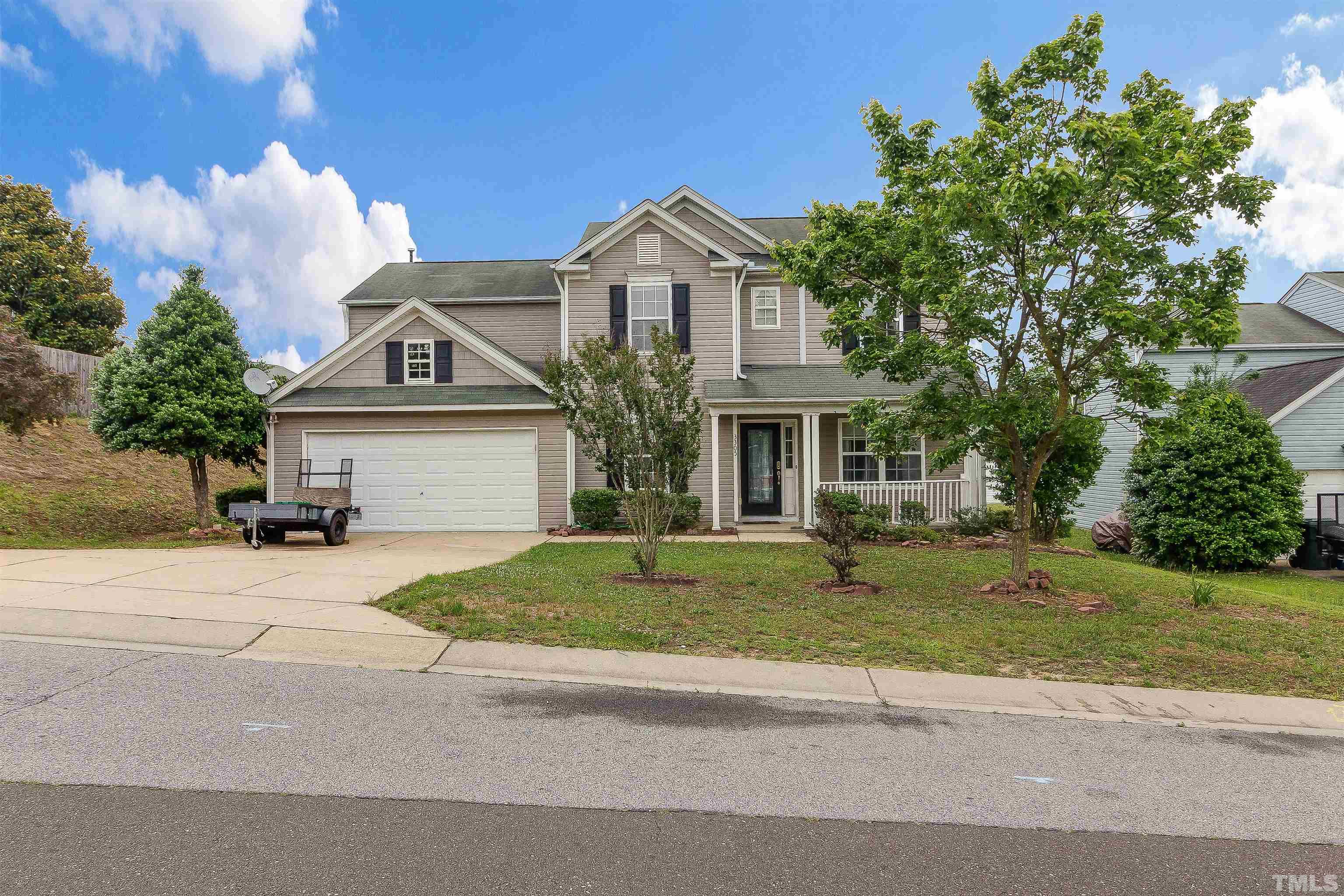 3305 Perkins Ridge Road Raleigh, NC 27610 - Photo 1 of 22 a front view of a house with a yard