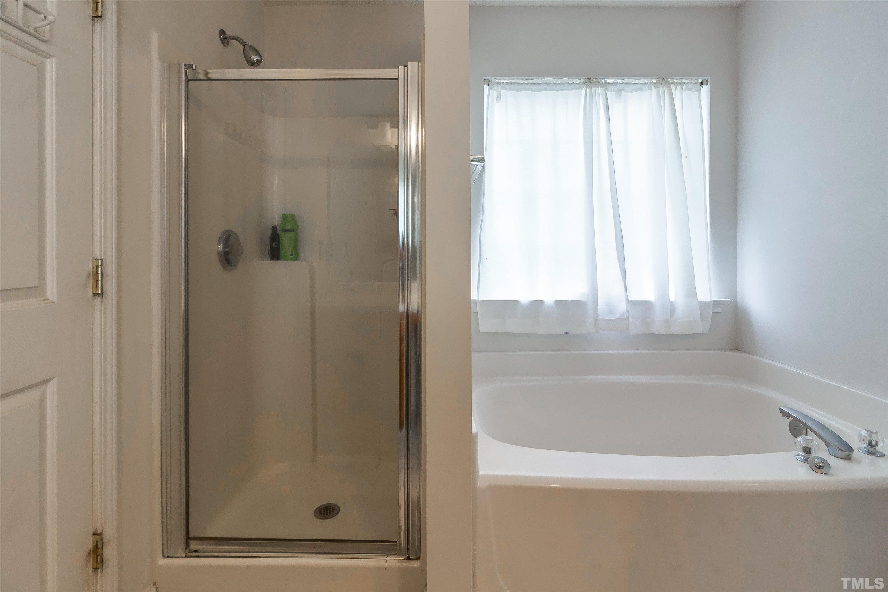 3305 Perkins Ridge Road Raleigh, NC 27610 - Photo 14 of 22 a bathroom with a bathtub and shower