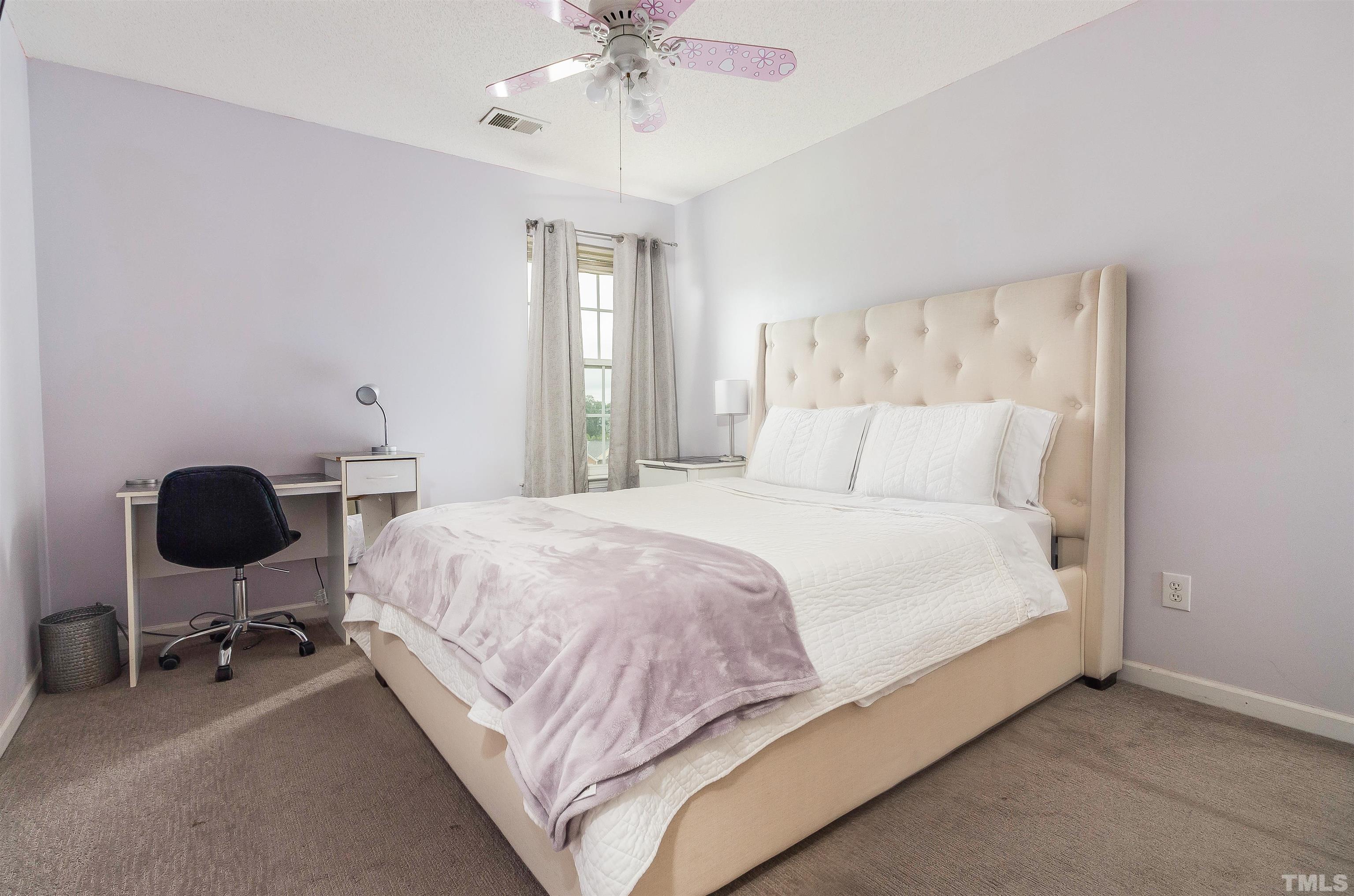 3305 Perkins Ridge Road Raleigh, NC 27610 - Photo 19 of 22 a bedroom with a bed workspace and a window