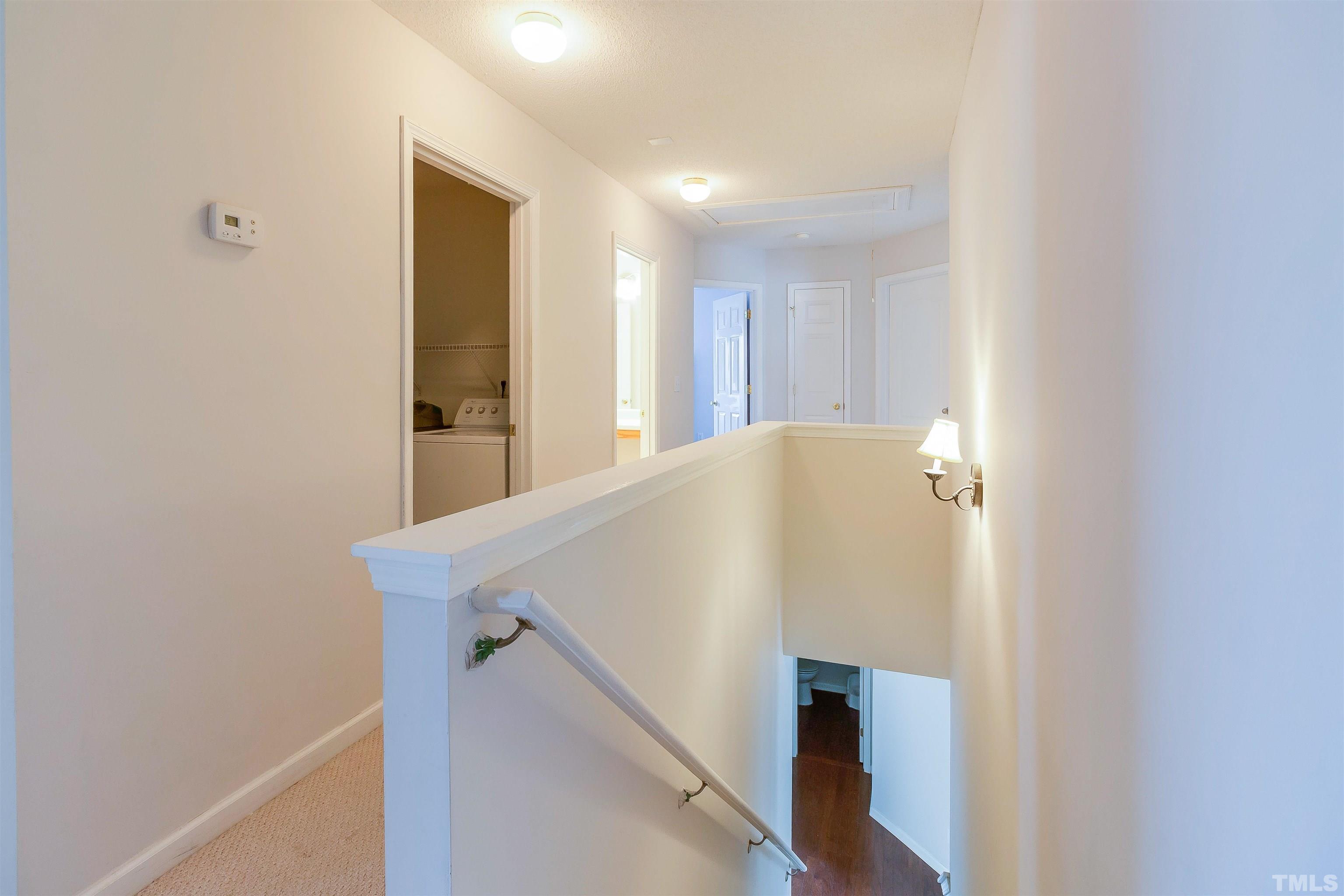 3305 Perkins Ridge Road Raleigh, NC 27610 - Photo 21 of 22 a view of a hallway with wooden floor