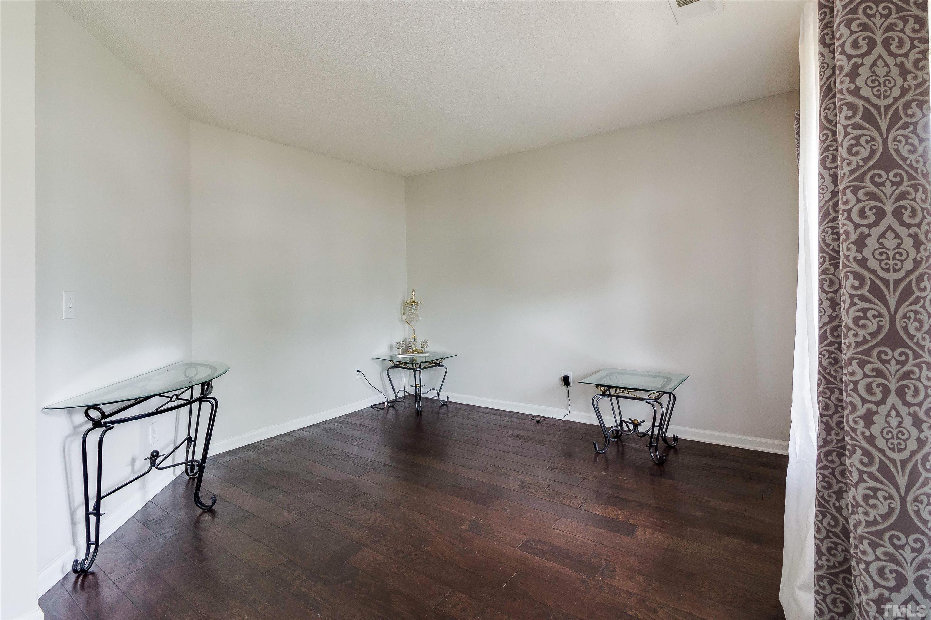 3305 Perkins Ridge Road Raleigh, NC 27610 - Photo 7 of 22 a view of a livingroom with furniture and wooden floor