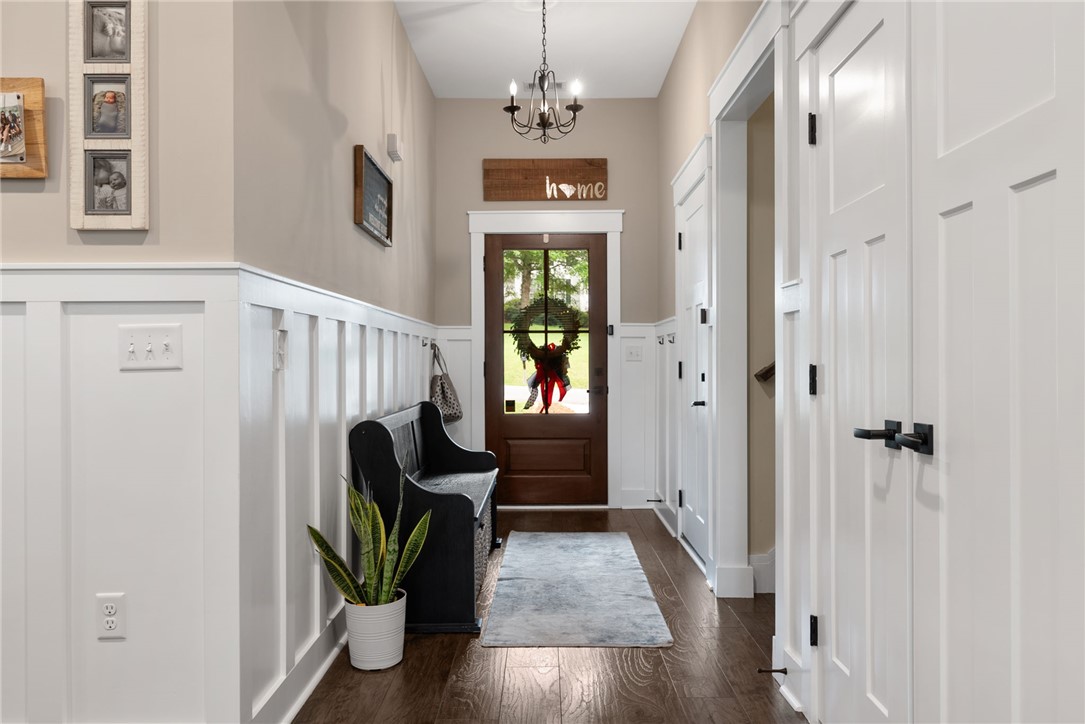 201 Hearthstone Drive Anderson, SC 29621 - Photo 8 of 49 Rich hardwood floors welcome you into this inviting entry hall with classic wainscoting.