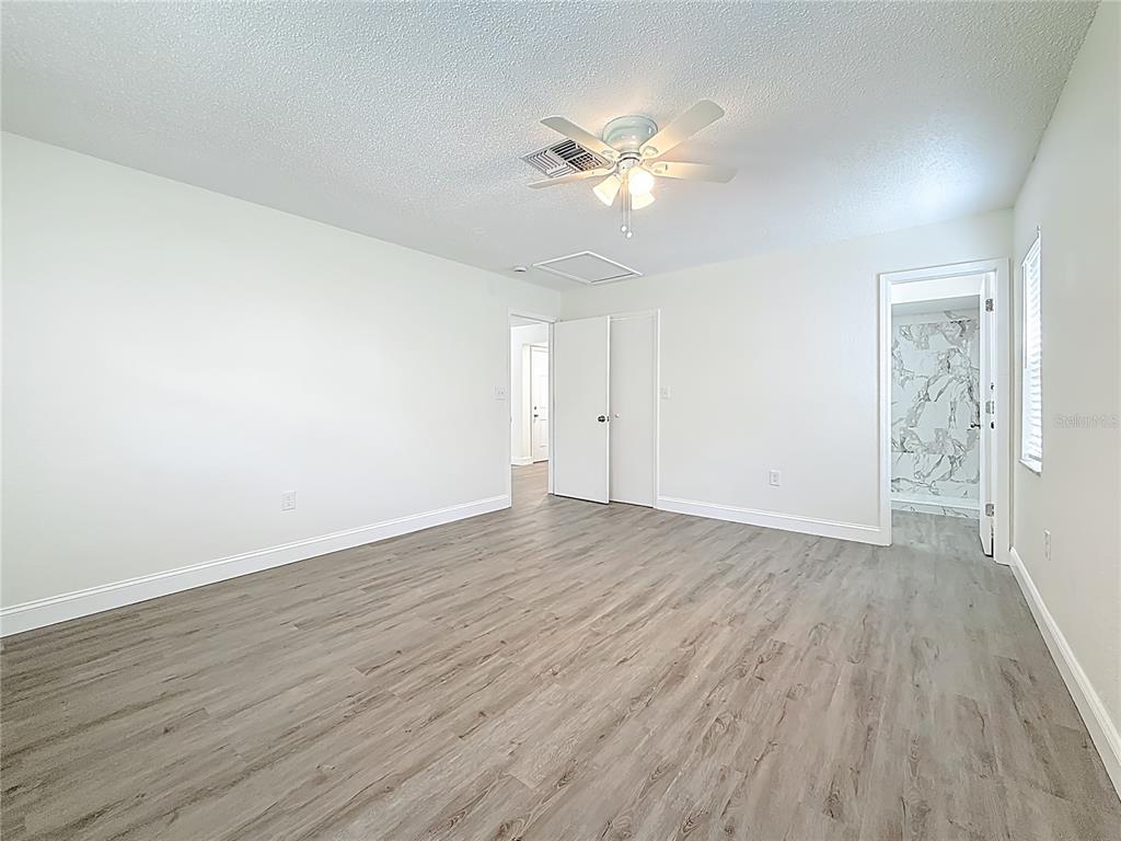 7480 118th Terrace Largo, FL 33773 - Photo 30 of 49 a view of an empty room with wooden floor