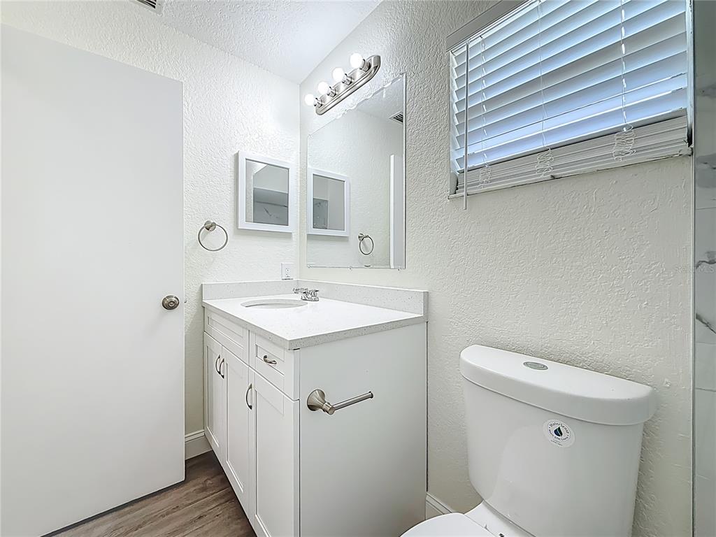 7480 118th Terrace Largo, FL 33773 - Photo 42 of 49 a bathroom with a sink a toilet and shower