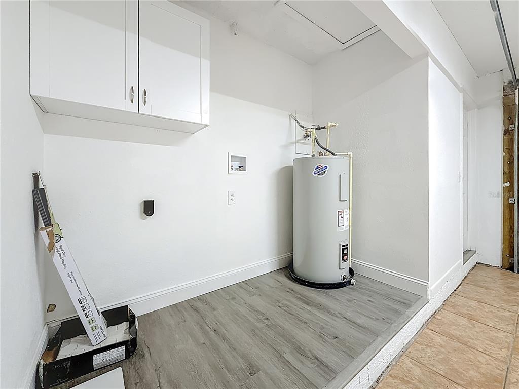 7480 118th Terrace Largo, FL 33773 - Photo 43 of 49 a view of a storage & utility room with closet wooden floor
