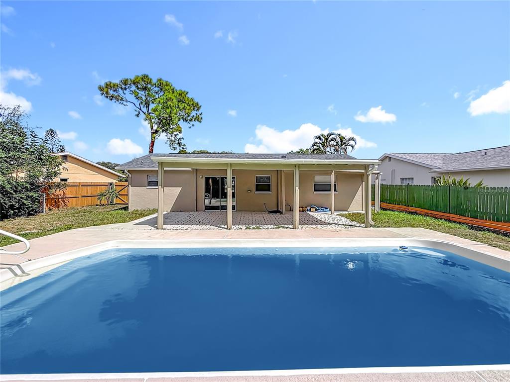 7480 118th Terrace Largo, FL 33773 - Photo 48 of 49 a view of a house with table and chairs