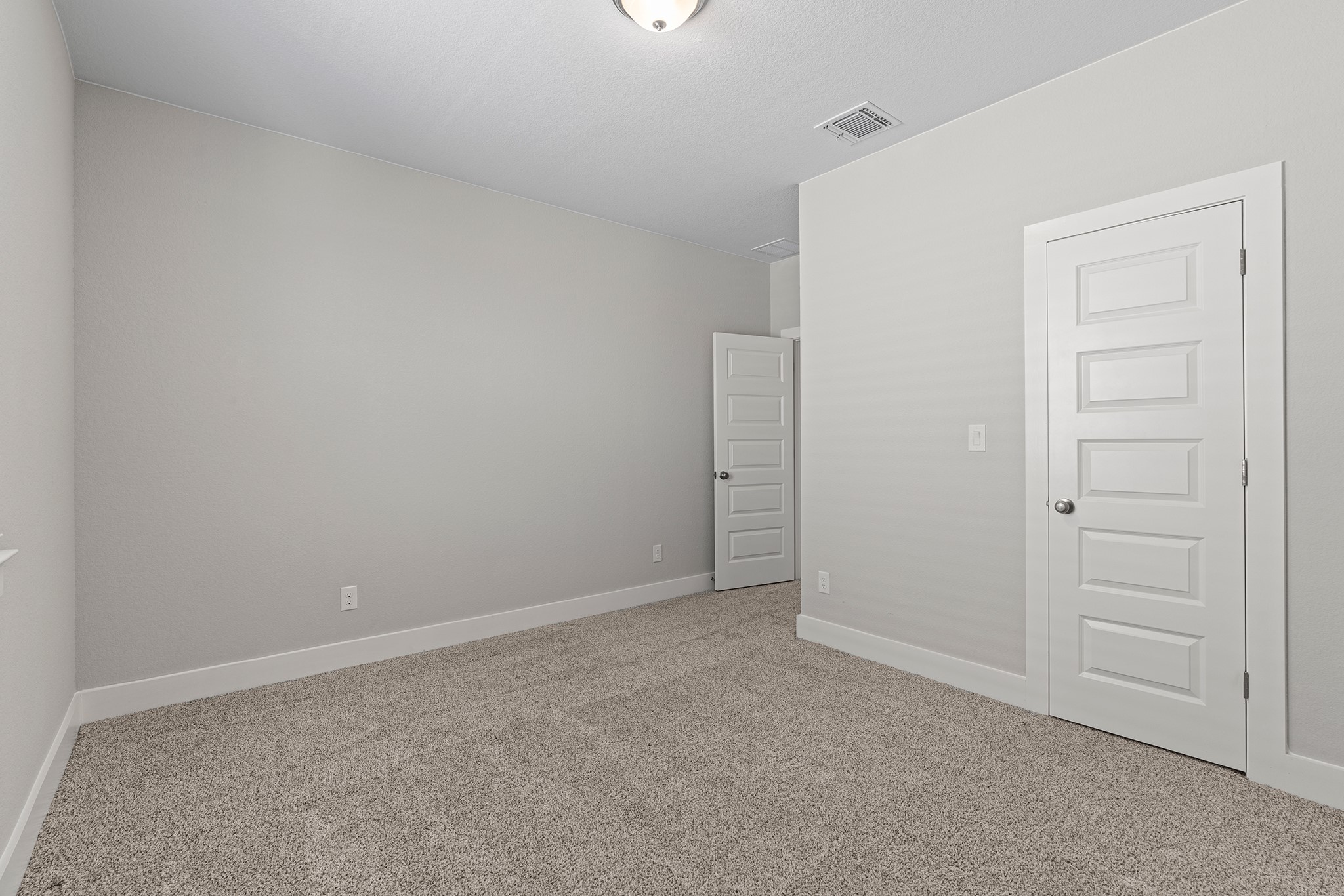 2112 Tobiano Trace Georgetown, TX 78633 - Photo 33 of 40 Unfurnished bedroom with light carpet and baseboards