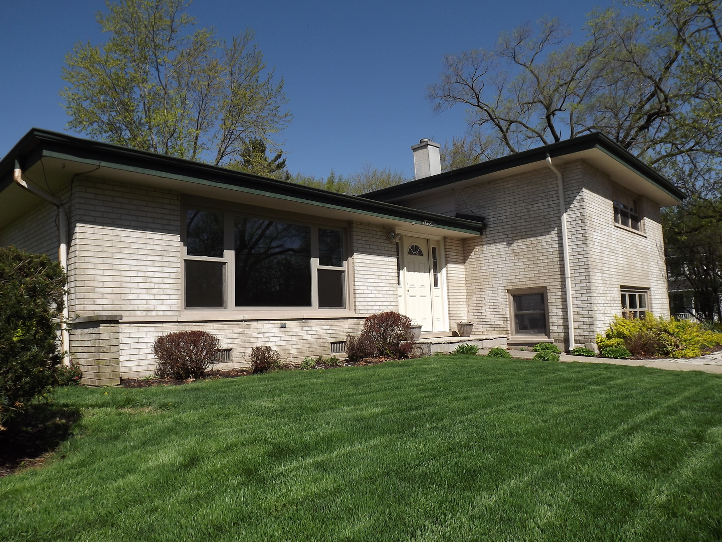 18056 Perth Avenue Homewood, IL 60430 - Photo 1 of 42 a front view of a house with a yard