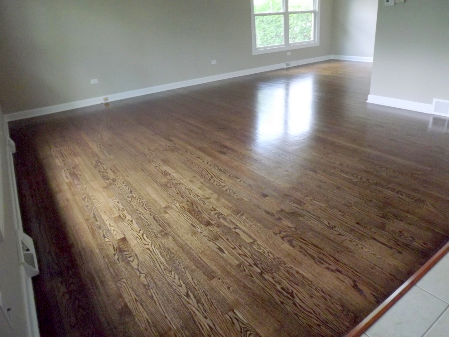 18056 Perth Avenue Homewood, IL 60430 - Photo 14 of 42 wooden floor in an empty room with a window