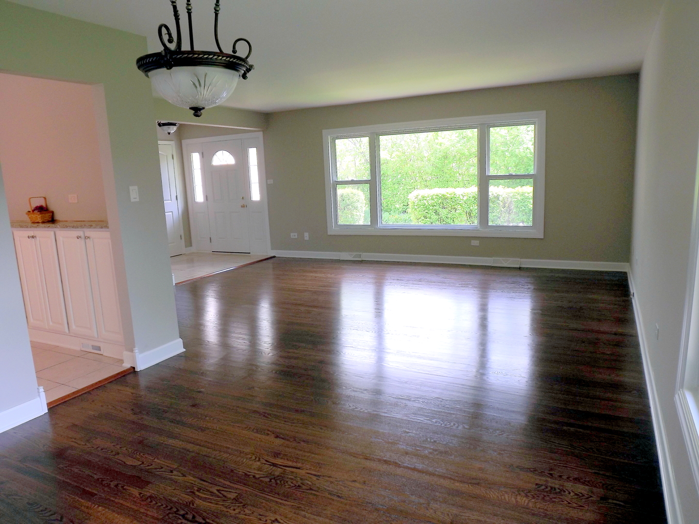 18056 Perth Avenue Homewood, IL 60430 - Photo 18 of 42 a view of an empty room with wooden floor and a window