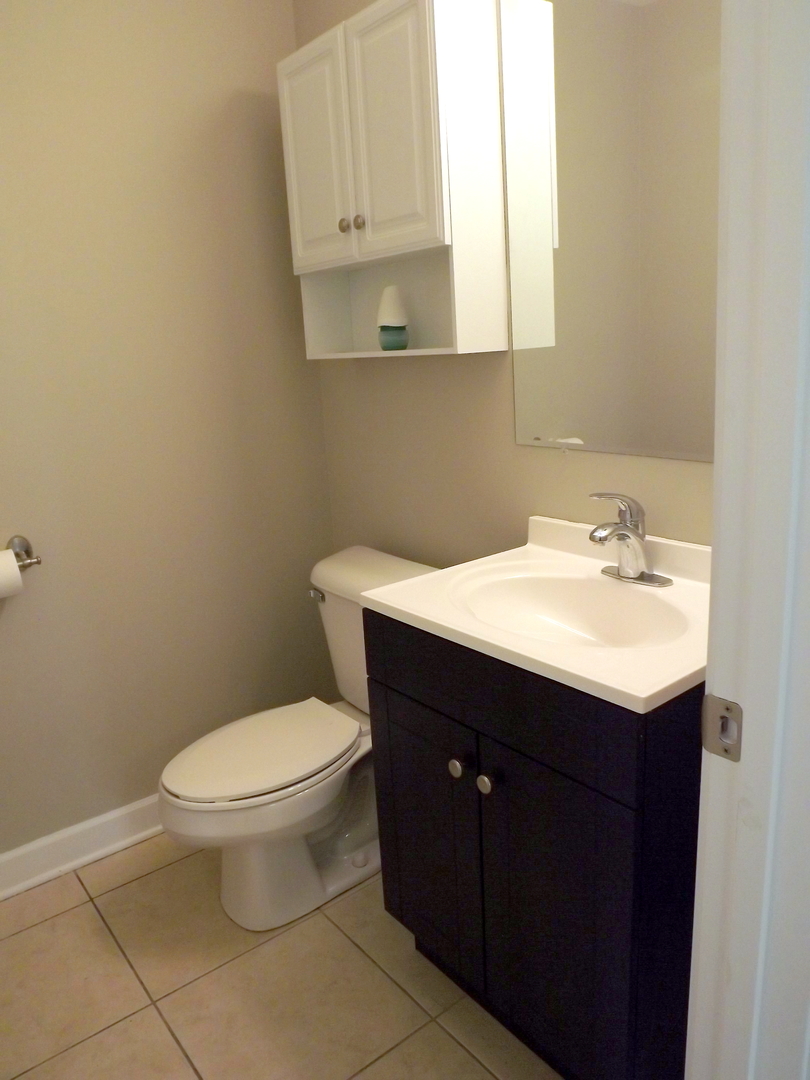 18056 Perth Avenue Homewood, IL 60430 - Photo 27 of 42 a bathroom with a sink and a toilet
