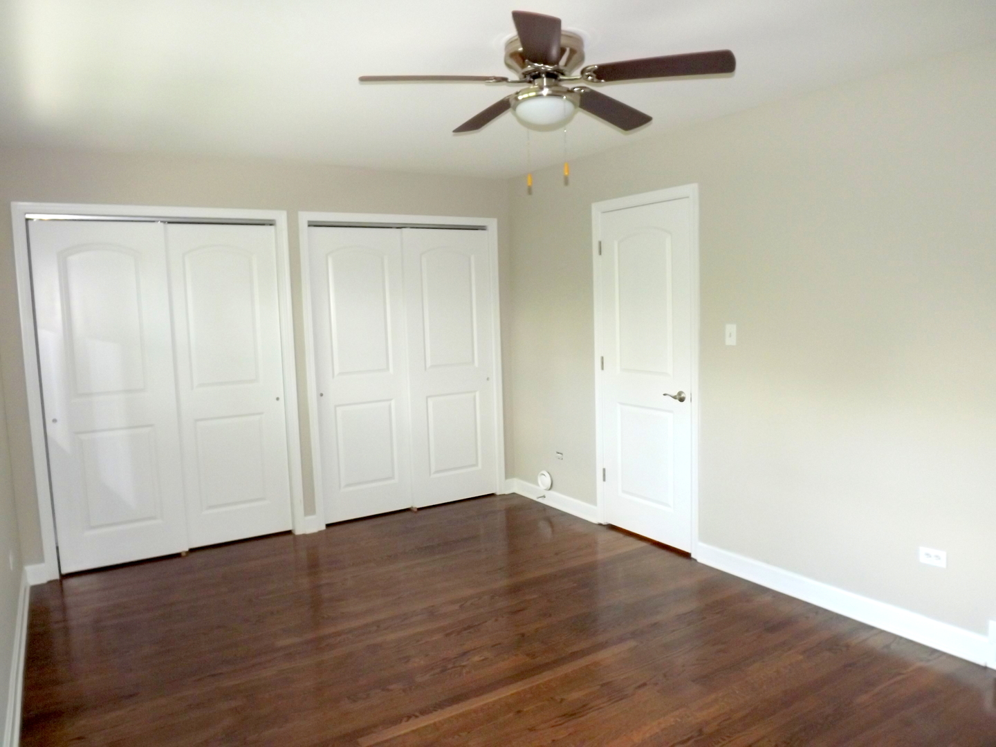 18056 Perth Avenue Homewood, IL 60430 - Photo 28 of 42 a view of empty room with wooden floor and fan