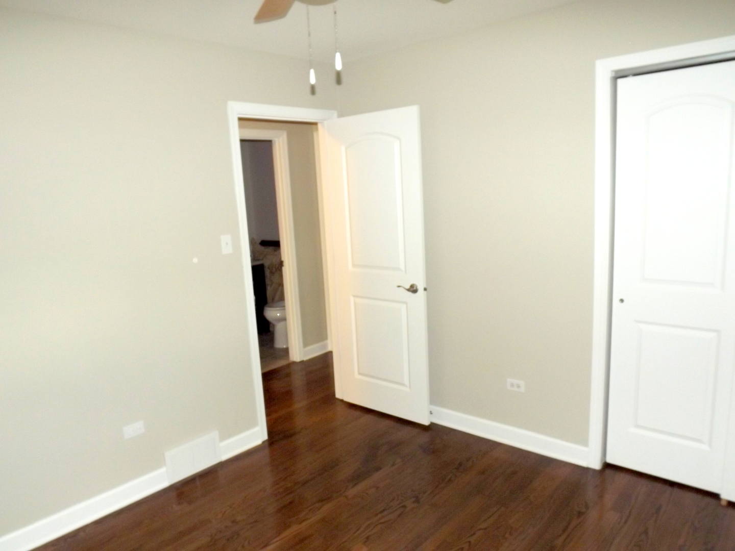 18056 Perth Avenue Homewood, IL 60430 - Photo 32 of 42 an empty room with wooden floor