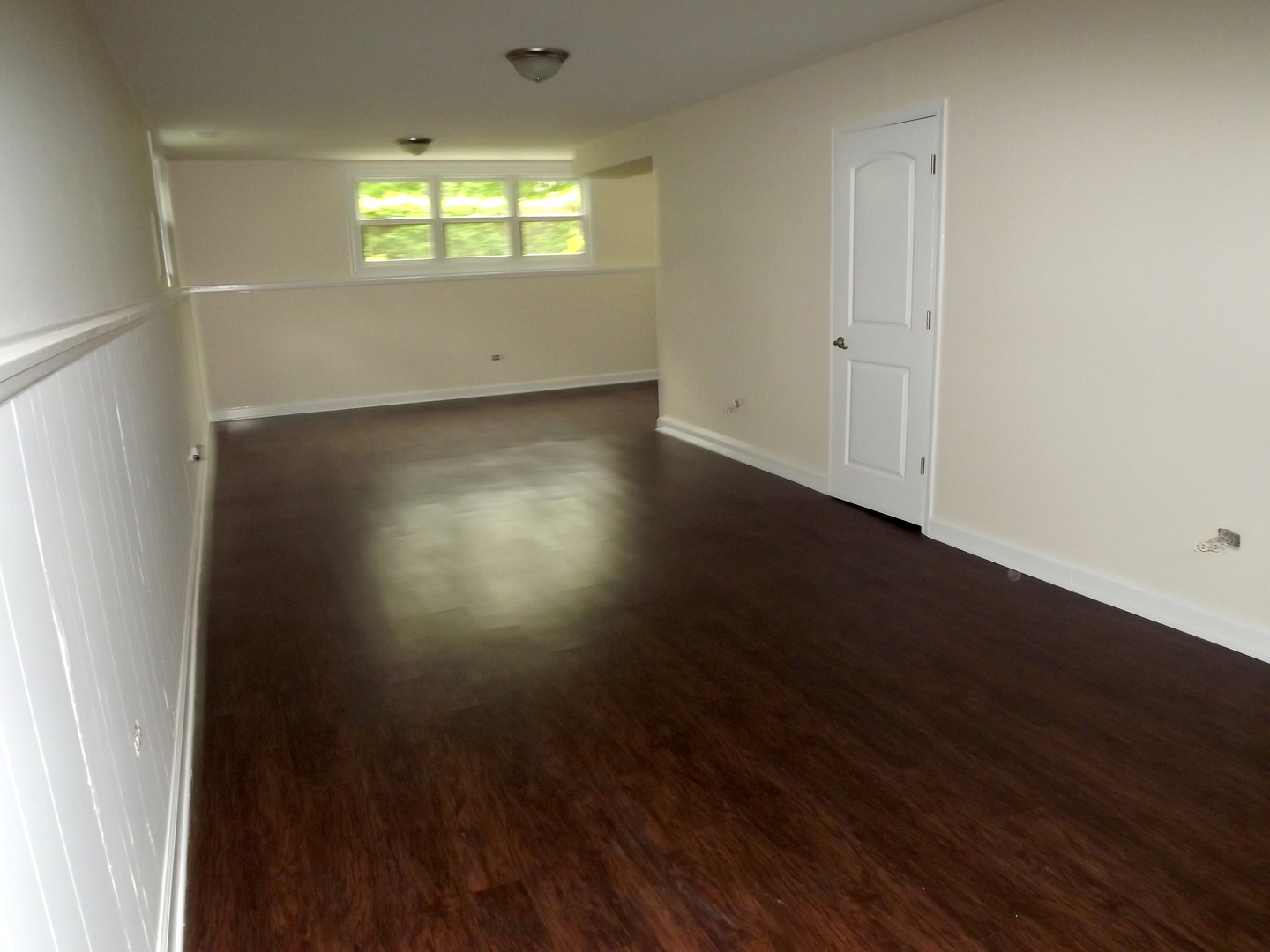 18056 Perth Avenue Homewood, IL 60430 - Photo 35 of 42 an empty room with wooden floor and windows