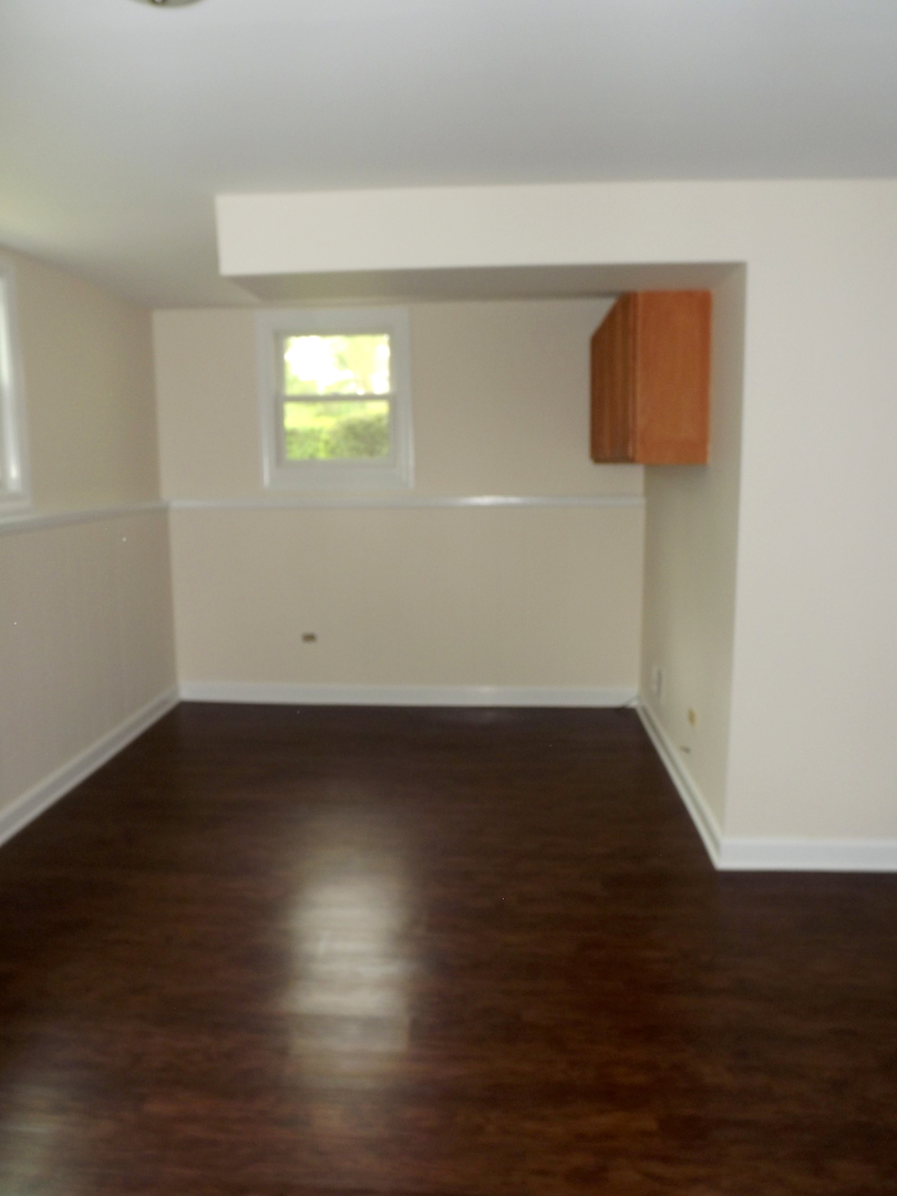 18056 Perth Avenue Homewood, IL 60430 - Photo 38 of 42 a view of wooden floor and windows in a room