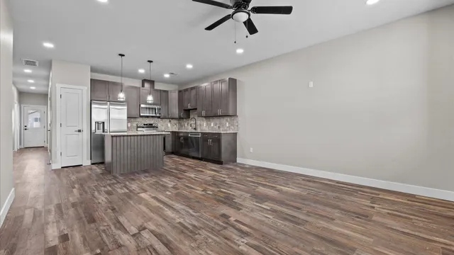 a view of kitchen with wooden floor