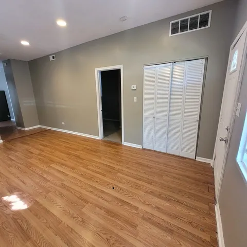wooden floor in a hall with a window