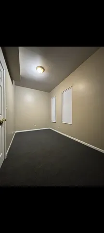 a view of kitchen with kitchen island microwave and wooden floor