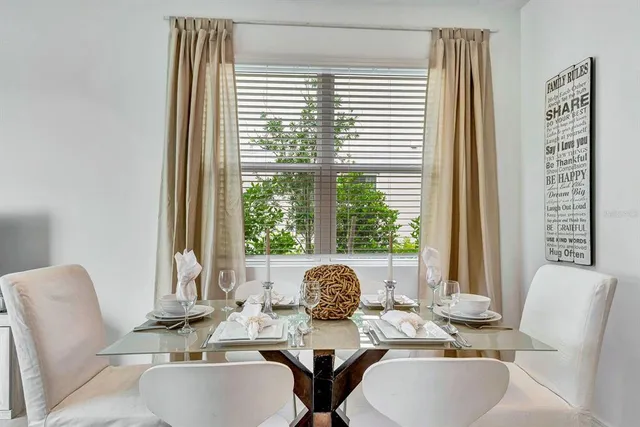 a dining room with furniture and window