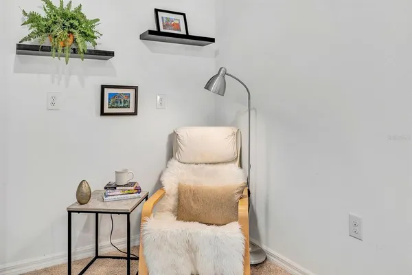 a bedroom with a bed and a table in it